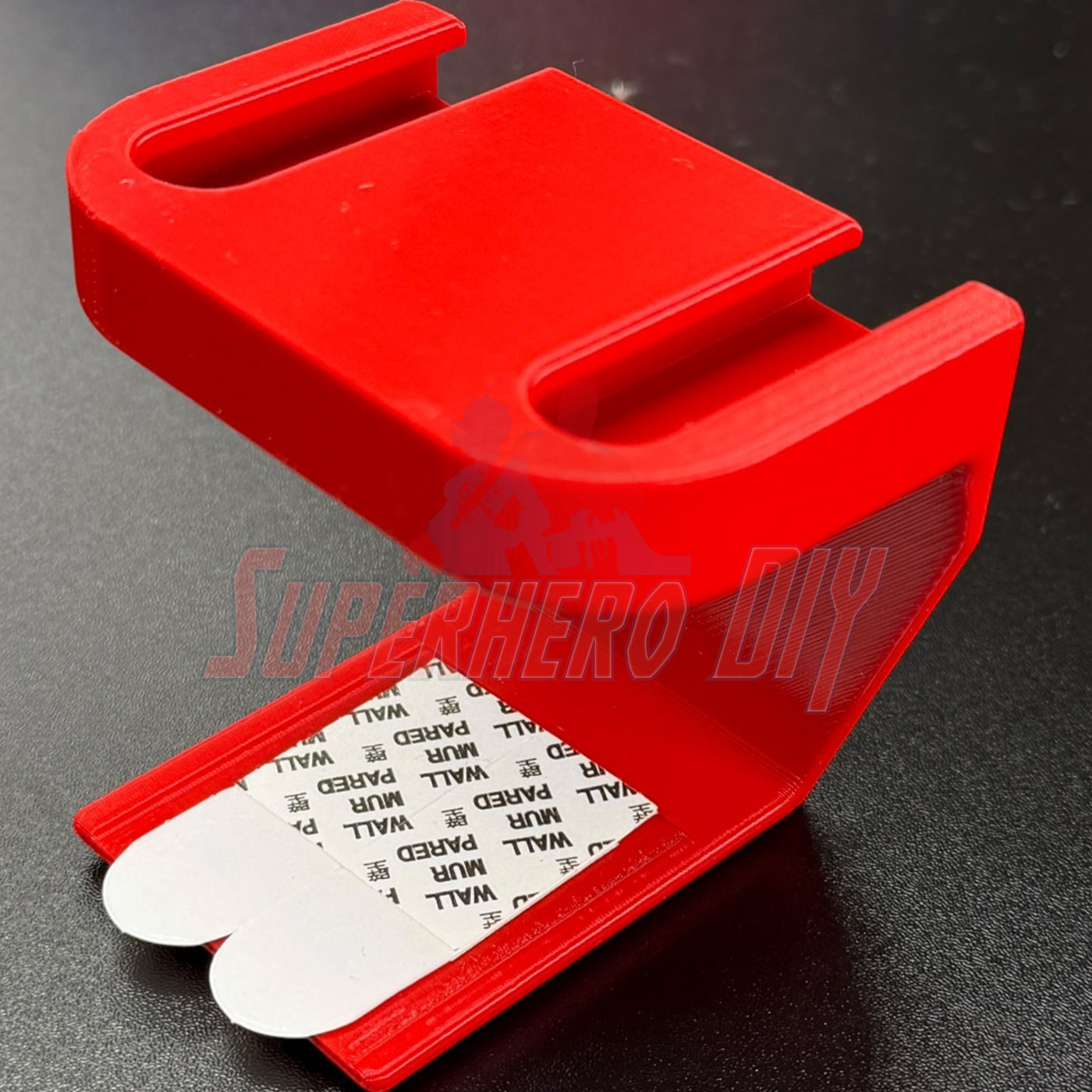 under-desk PS5 controller mount in red, designed for charging while stored, no drilling required