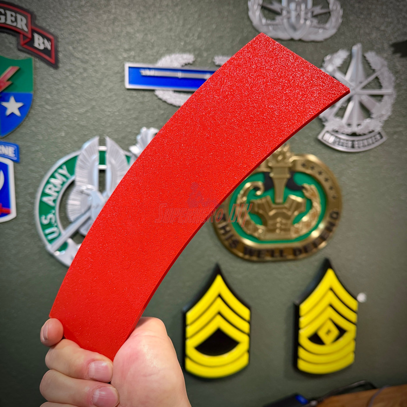 3D sapper tab display held in hand, showcasing achievement for combat engineers and SLC graduates.