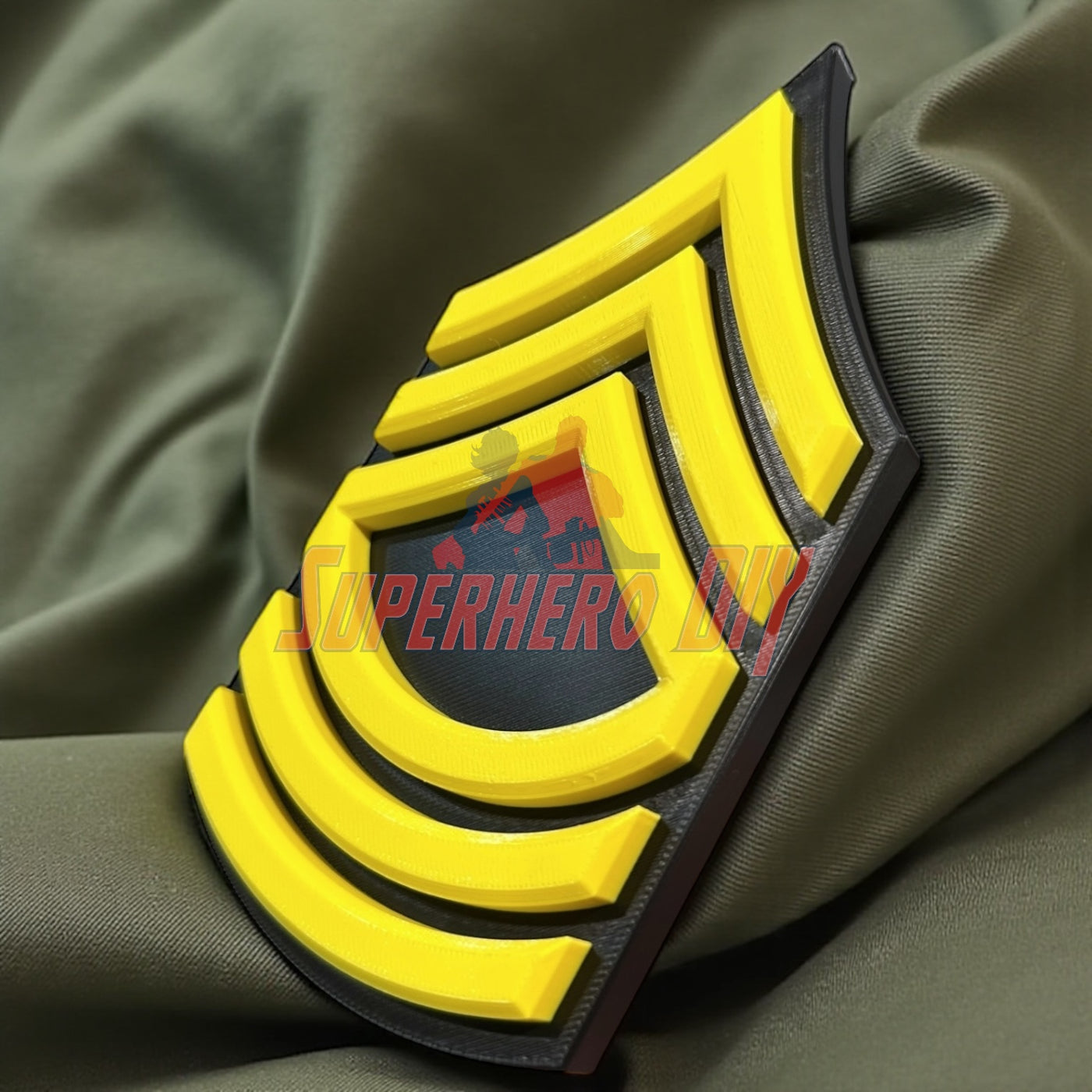 Army enlisted rank insignia featuring a bold yellow design on a black background.