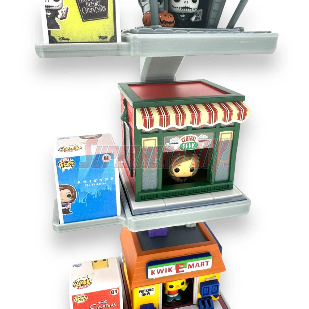 Stackable floating shelf for Bitty Pop Towns sets, designed to hold Funko figures and town box in a vertical wall-mounted display