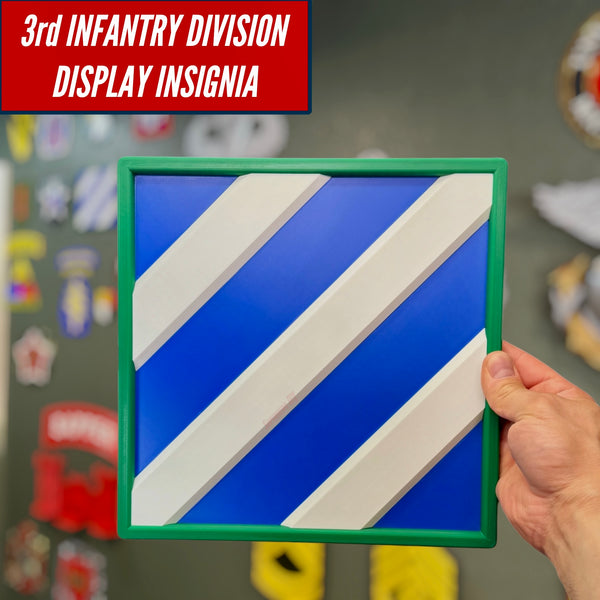 3rd Infantry Division display insignia showcased in hand, bold blue and white design for honoring military service.