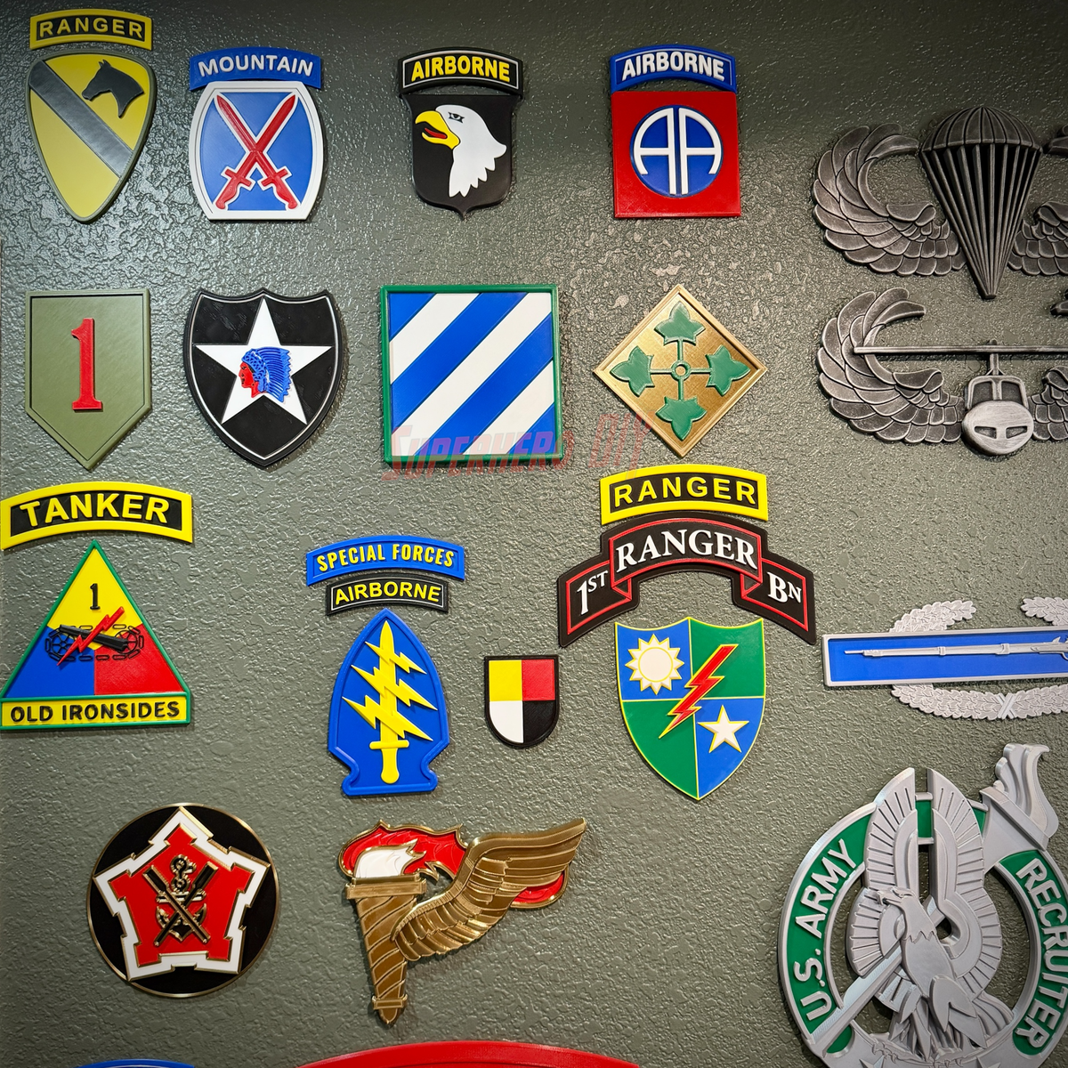 3rd Infantry Division display insignia patches on wall showcasing military unit symbols and pride.