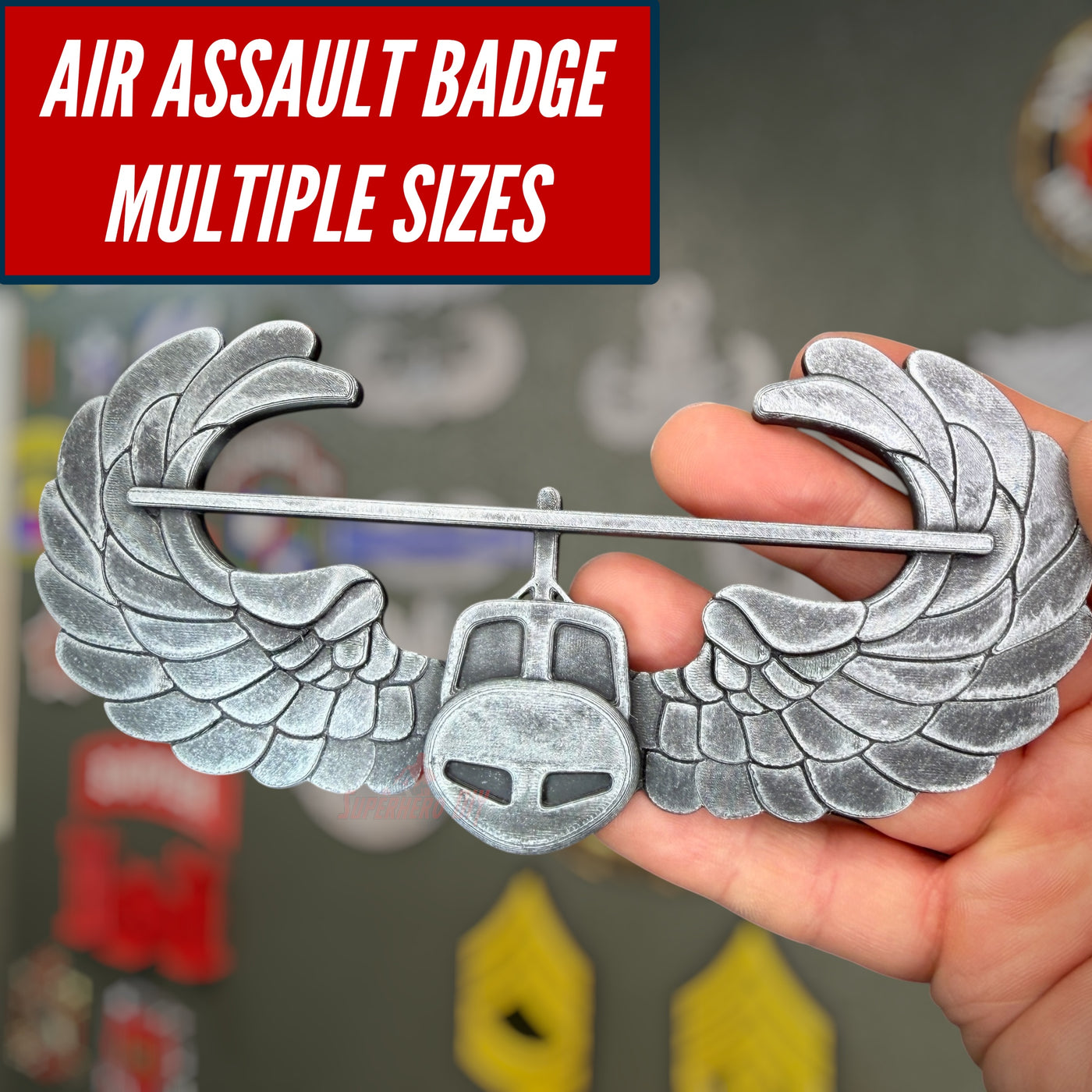 Subdued air assault badge display, showcasing its wings and multiple size options for military insignia.