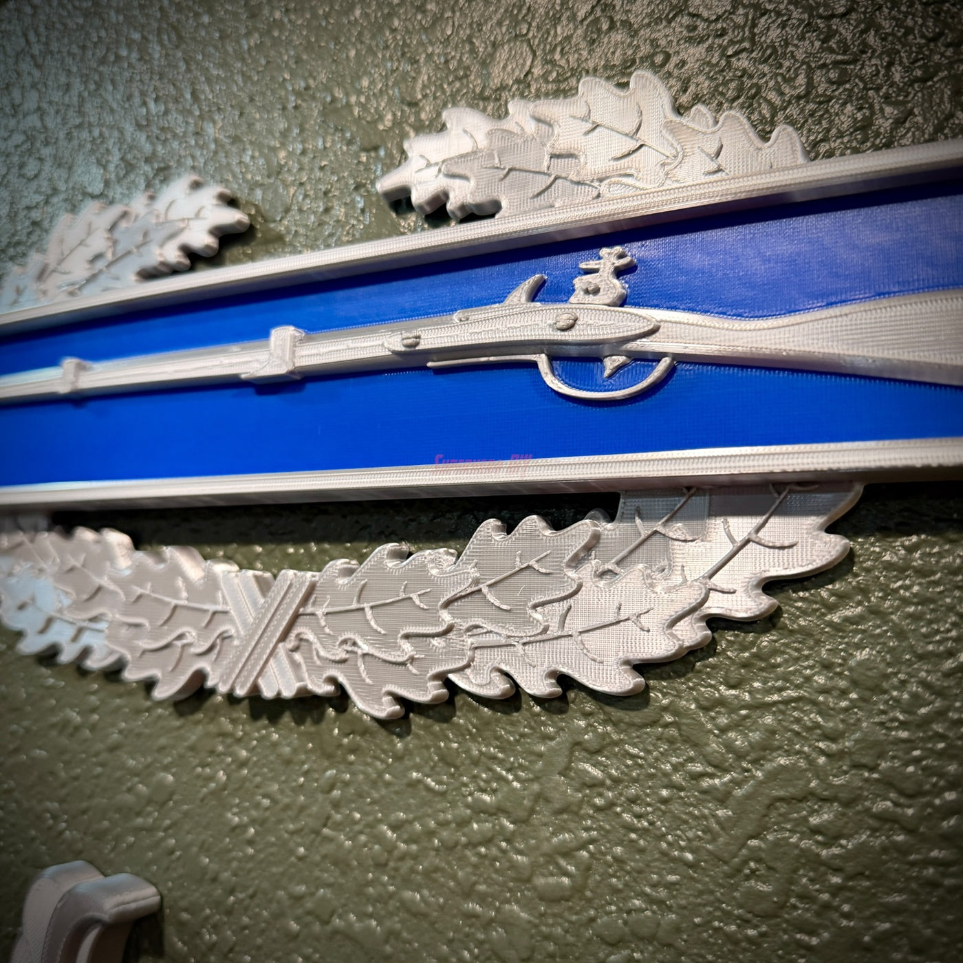 Close-up of Infantryman Badge featuring a musket on infantry-blue bar, ideal for display.