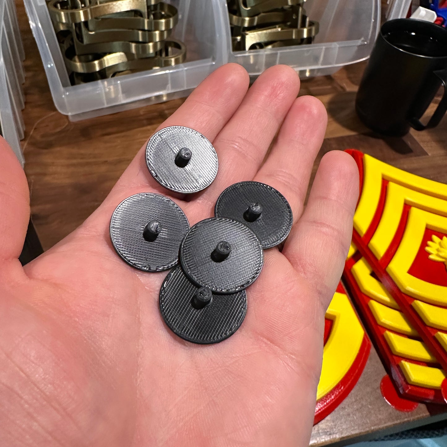 Display Stands for Disney Doorables showing round peg bases in hand for organizing figures