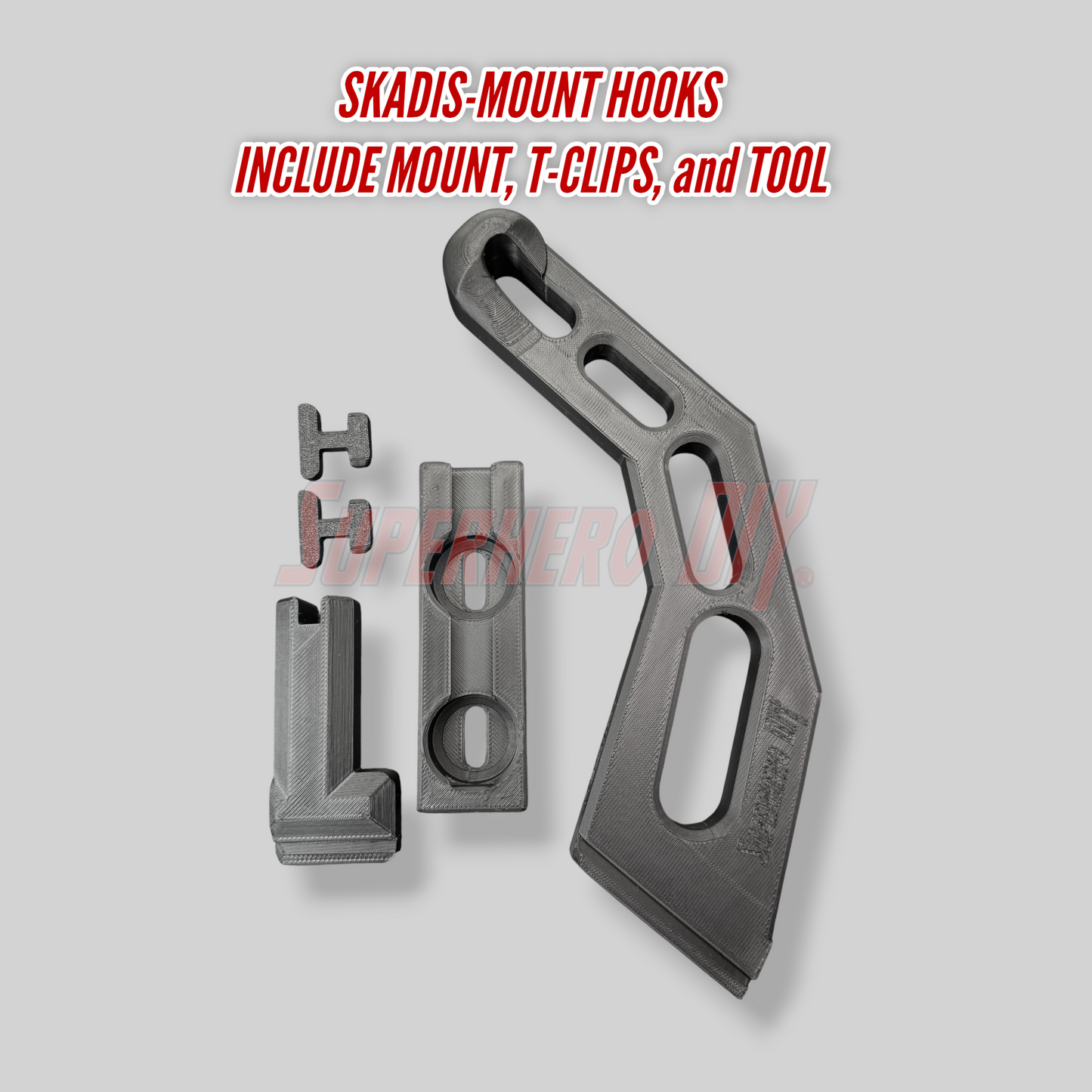 Metal SKADIS-MOUNT HOOKS with mount, T-clips, and tool on a gray background