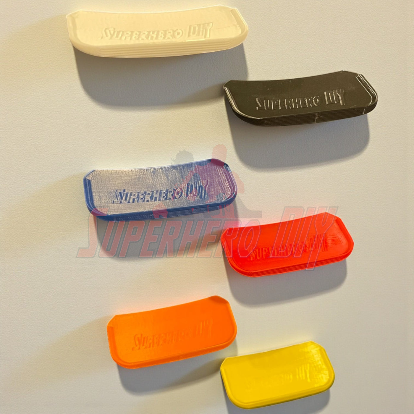 Colorful display shelf for Hot Wheels cars with command strip, perfect for organizing 1:64 diecast vehicles on a wall.