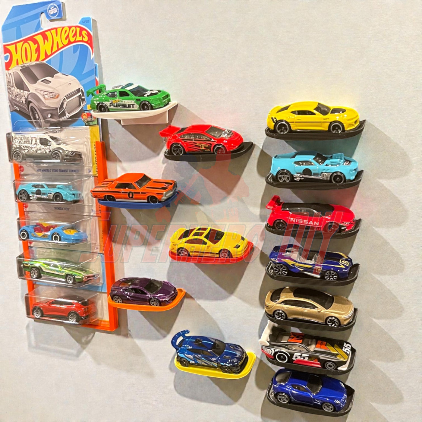 Display shelf for Hot Wheels with Command strip, featuring 1:64 diecast cars arranged neatly on a clean wall display.