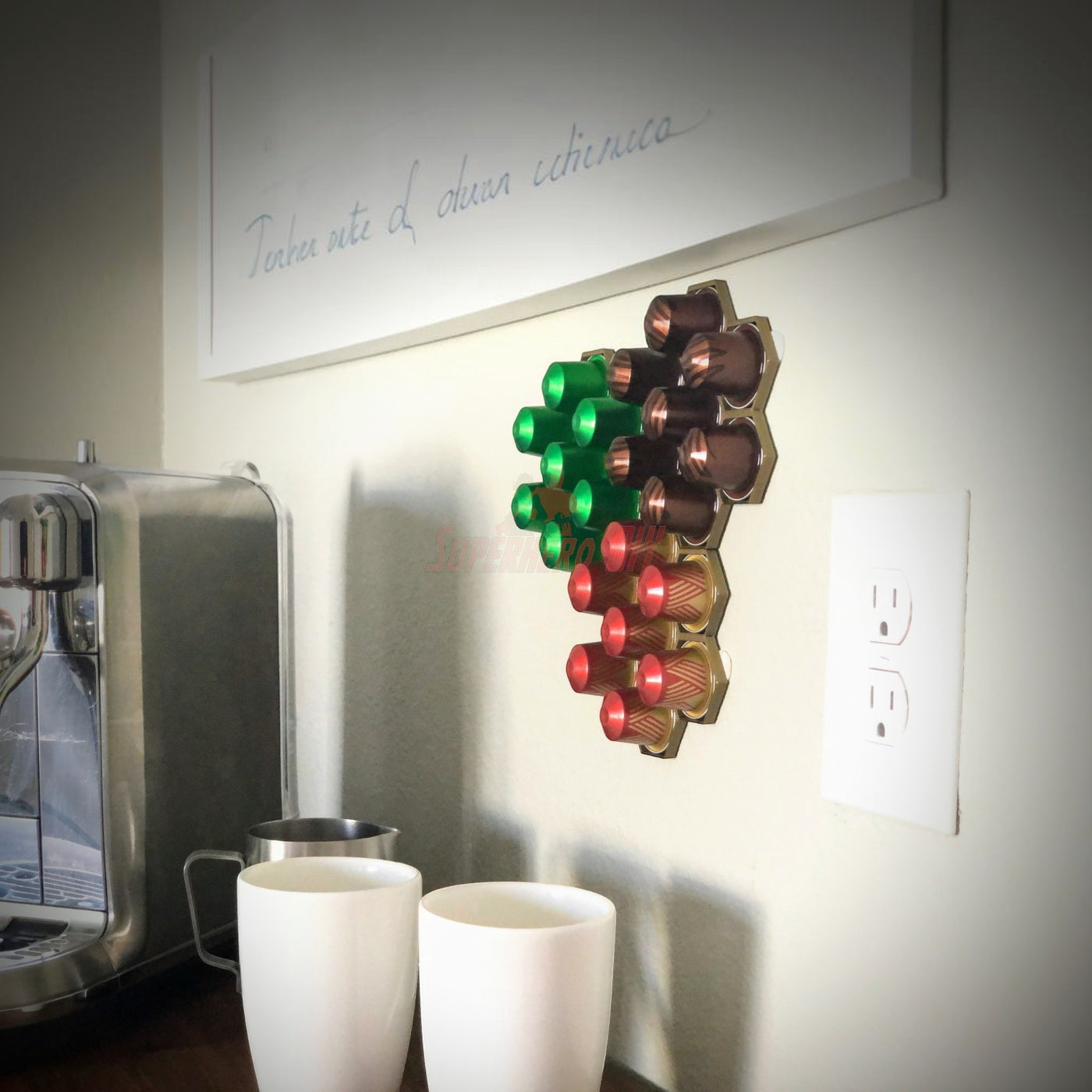 Honeycomb wall mount for original Nespresso coffee pod organizer showcasing colorful capsules in a kitchen setting.