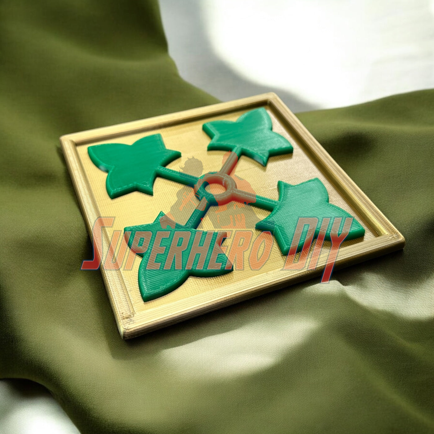3D-printed 4th Infantry Division display insignia on fabric background