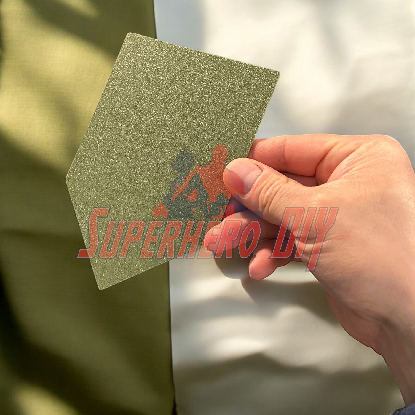 Person holding 1st Infantry Division display insignia patch for wall display or shadowbox