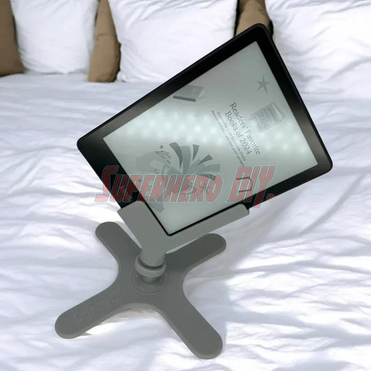 kindle side-reading holder, holding a Kindle paperwhite at an angle perfect for bed reading, in gray