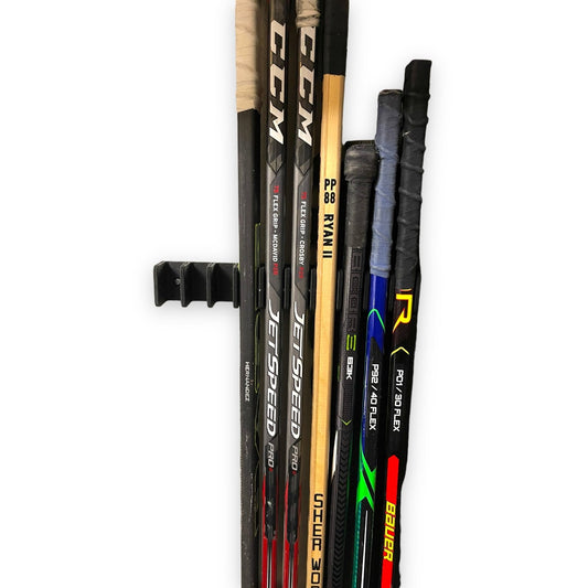 Organize your hockey sticks with this great 10-stick hockey stick holder! - SuperheroDIY