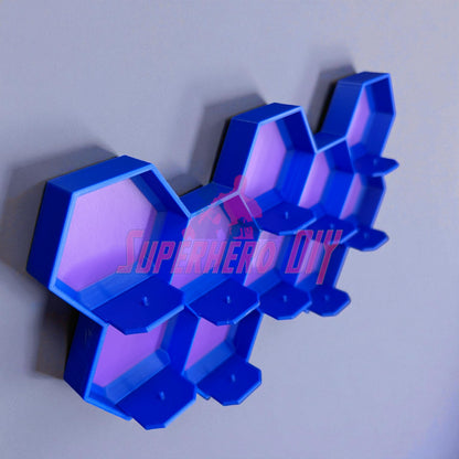 10-Cell honeycomb display for Disney Doorables mounted on a wall, showing hexagonal cells in blue and purple with foot pegs for mini figures.