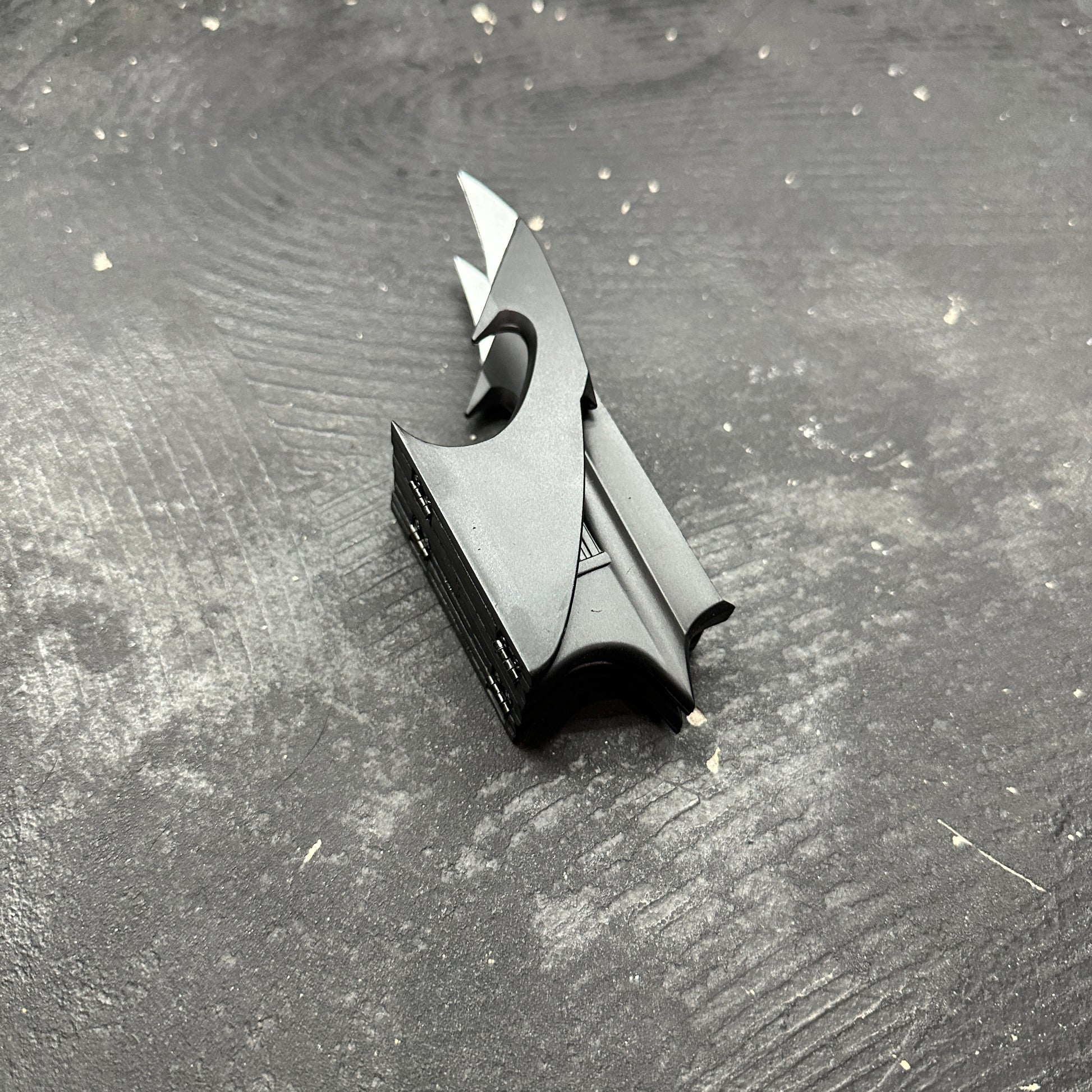 NECA BATMAN 1989 Folding Magnetic Batarang (LOOSE) displayed on a textured surface.