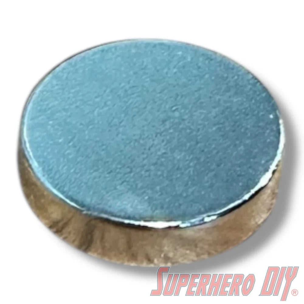 Small silver round neodymium disc magnet with smooth metallic surface and polished edges. - SuperheroDIY