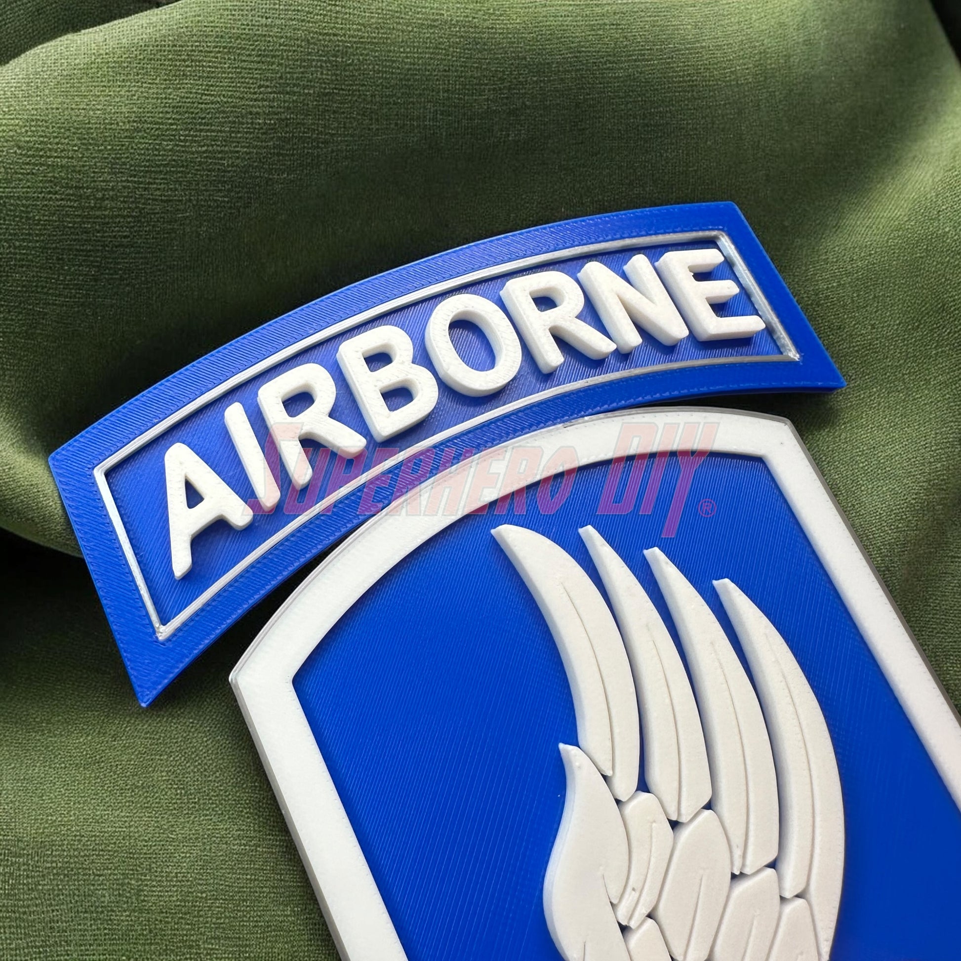 173rd Airborne Brigade display insignia featuring blue background and wing design.