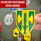 Hand holding 18th Military Police Brigade Display Insignia for wall mount or shadowbox.