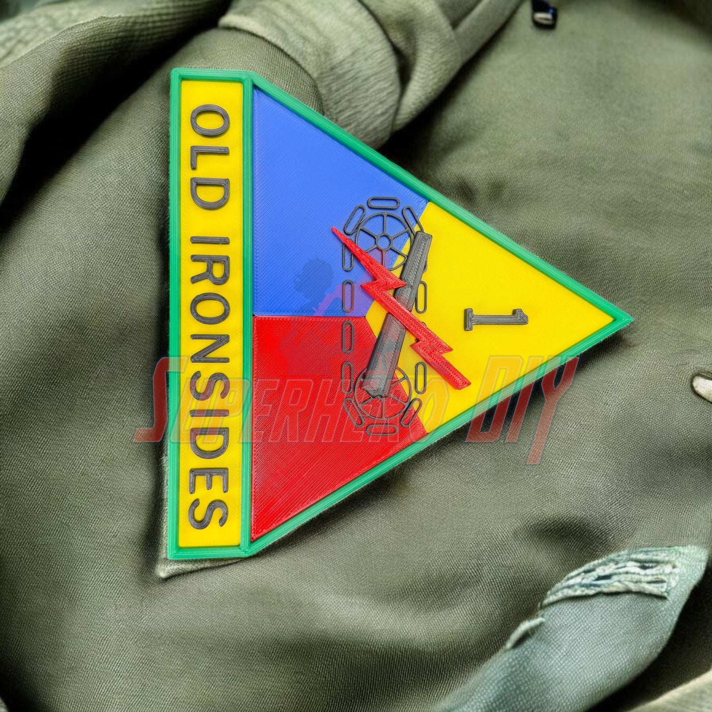 1st Armored Division display insignia featuring OLD IRONSIDES emblem on a military uniform