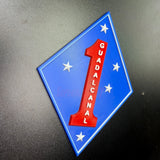 1st Marine Division insignia with blue diamond and red number one, featuring GUADALCANAL and Southern Cross stars.