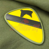 1st Cavalry Division Display Insignia on green fabric background