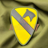 1st Cavalry Division Display Insignia on green fabric background, ideal for military decor in various settings.