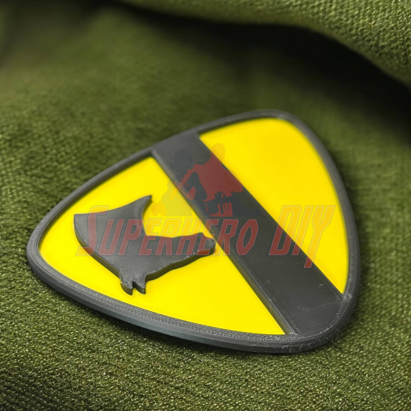 1st Cavalry Division Display Insignia on green fabric, perfect for military decor enthusiasts.
