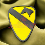 1st Cavalry Division Display Insignia on green fabric background