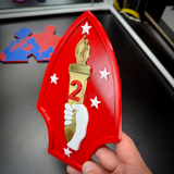 2nd Marine Division display insignia featuring a gold torch and red spearhead, ideal for wall displays.