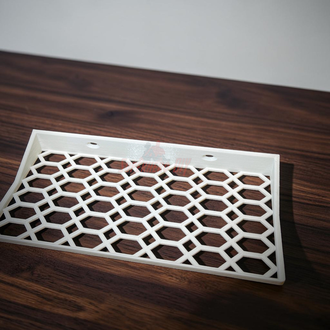 Floating shelf for Funko Pop 2-pack with hex lattice design on a wooden surface.