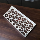 Floating shelf for Funko Pop 2-pack displaying a hex lattice design on a wooden surface.