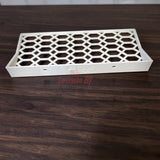 Floating shelf for Funko Pop 2-pack on a wooden surface, showcasing open hex lattice design.
