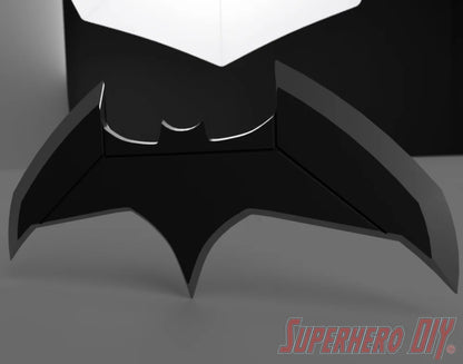 Black bat-shaped throwie with angular wings and a small bat symbol cutout at the center. - SuperheroDIY