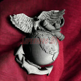 3D Marine Corps EGA insignia on display against a red background