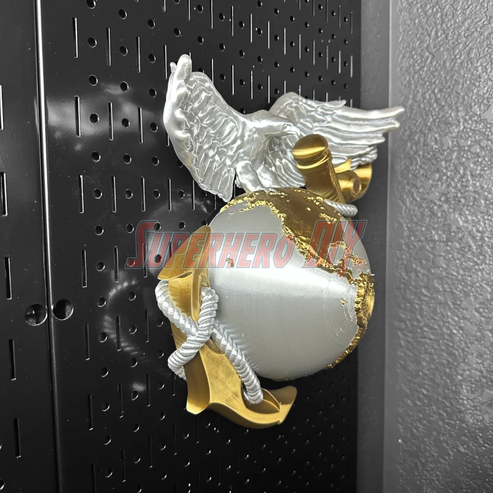 3D Marine Corps EGA insignia in gold and silver, mounted on a wall display