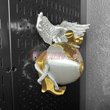 3D Marine Corps EGA insignia in gold and silver, mounted on a wall display