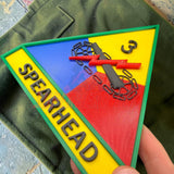 3rd Armored Division display insignia featuring Spearhead logo on a colorful triangular patch.