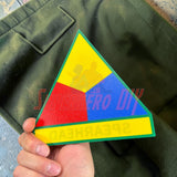 3rd Armored Division display insignia featuring the Spearhead logo in bright colors on a green background.