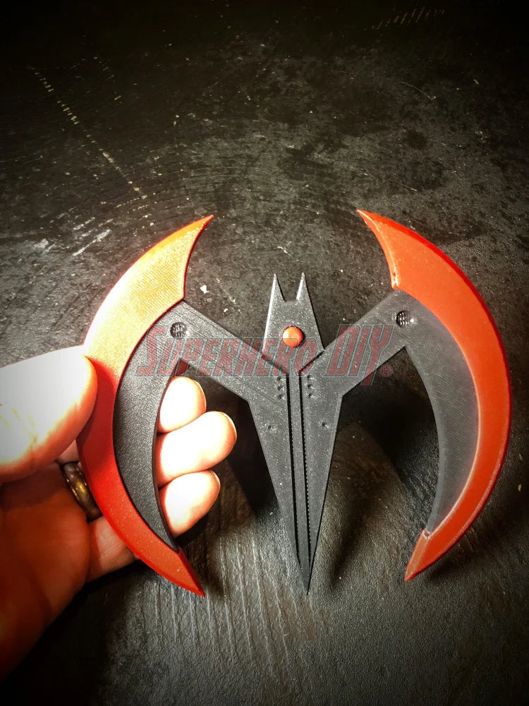 3D-printable Beyond Batarang STL file for future night bat guy prop in red and black held in hand
