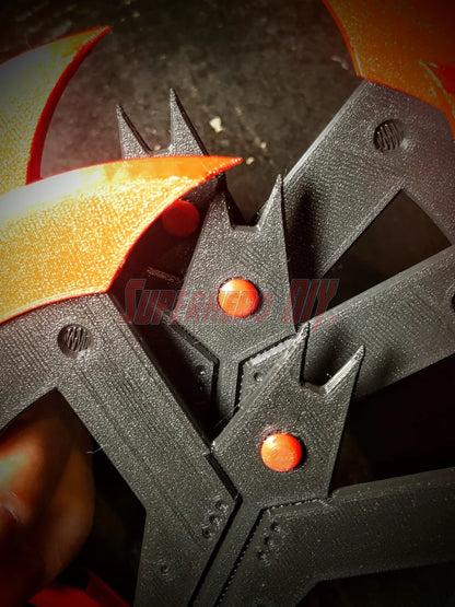 Close-up of 3D-printed Beyond Batarang model parts in orange and black, digital download for 3D-printable Beyond Batarang STL file.