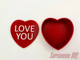 3D-PRINTABLE STL FILE | Candy Heart Gift Box | DIGITAL FILE ONLY - Red candy heart gift box with removable lid featuring white "LOVE YOU" text on top. - SuperheroDIY