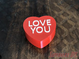 3D-PRINTABLE STL FILE | Candy Heart Gift Box | DIGITAL FILE ONLY - Red heart-shaped gift box with white "LOVE YOU" text on top, smooth glossy finish. - SuperheroDIY