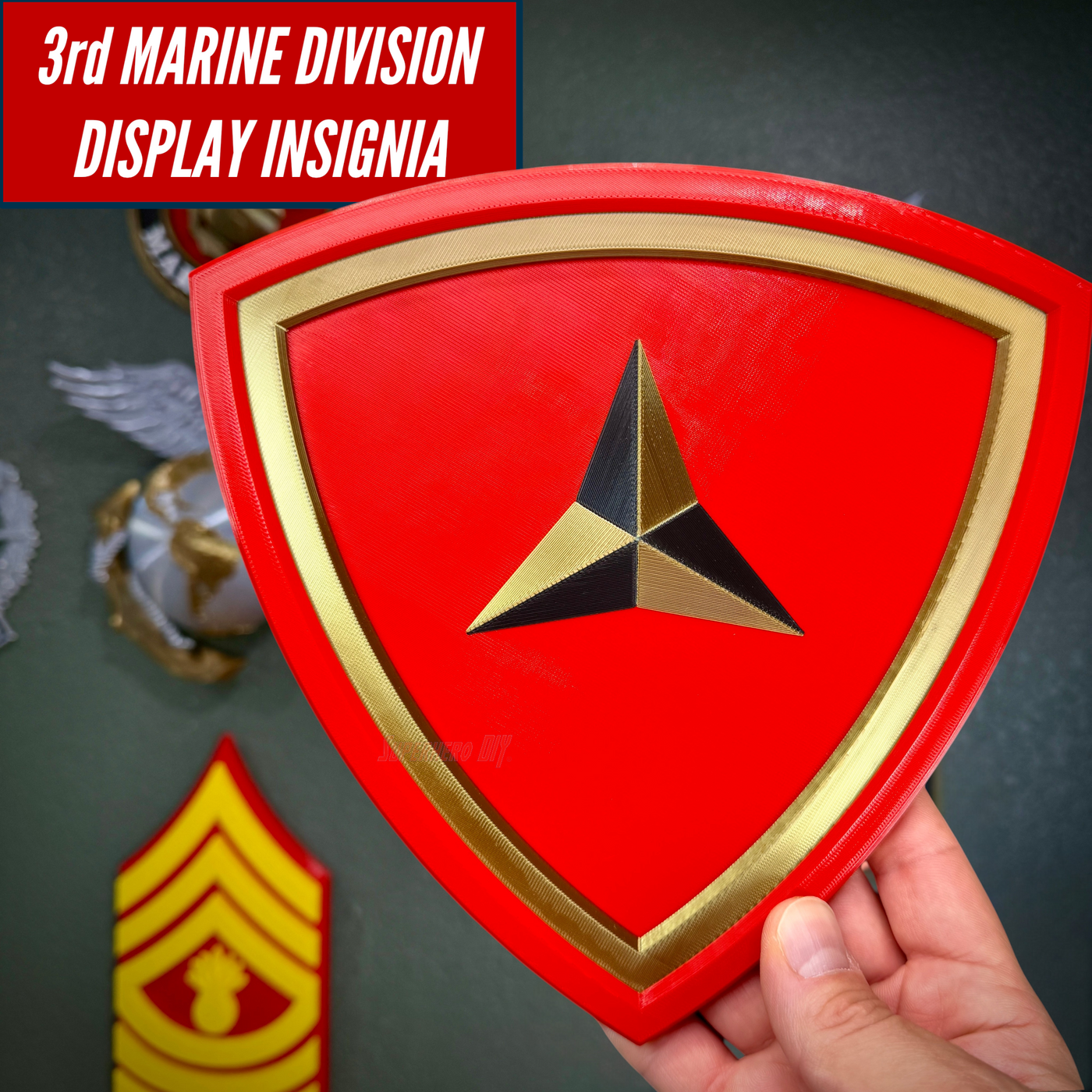 3rd Marine Division display insignia with scarlet shield and gold border, showcasing layered design and symbolic caltrap.