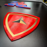 3rd Marine Division insignia in layered relief with scarlet shield and gold border, showcasing Fighting Third emblem.