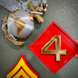 4th Marine Division display insignia with gold numeral four on a red background, showcasing the Fighting Fourth theme.