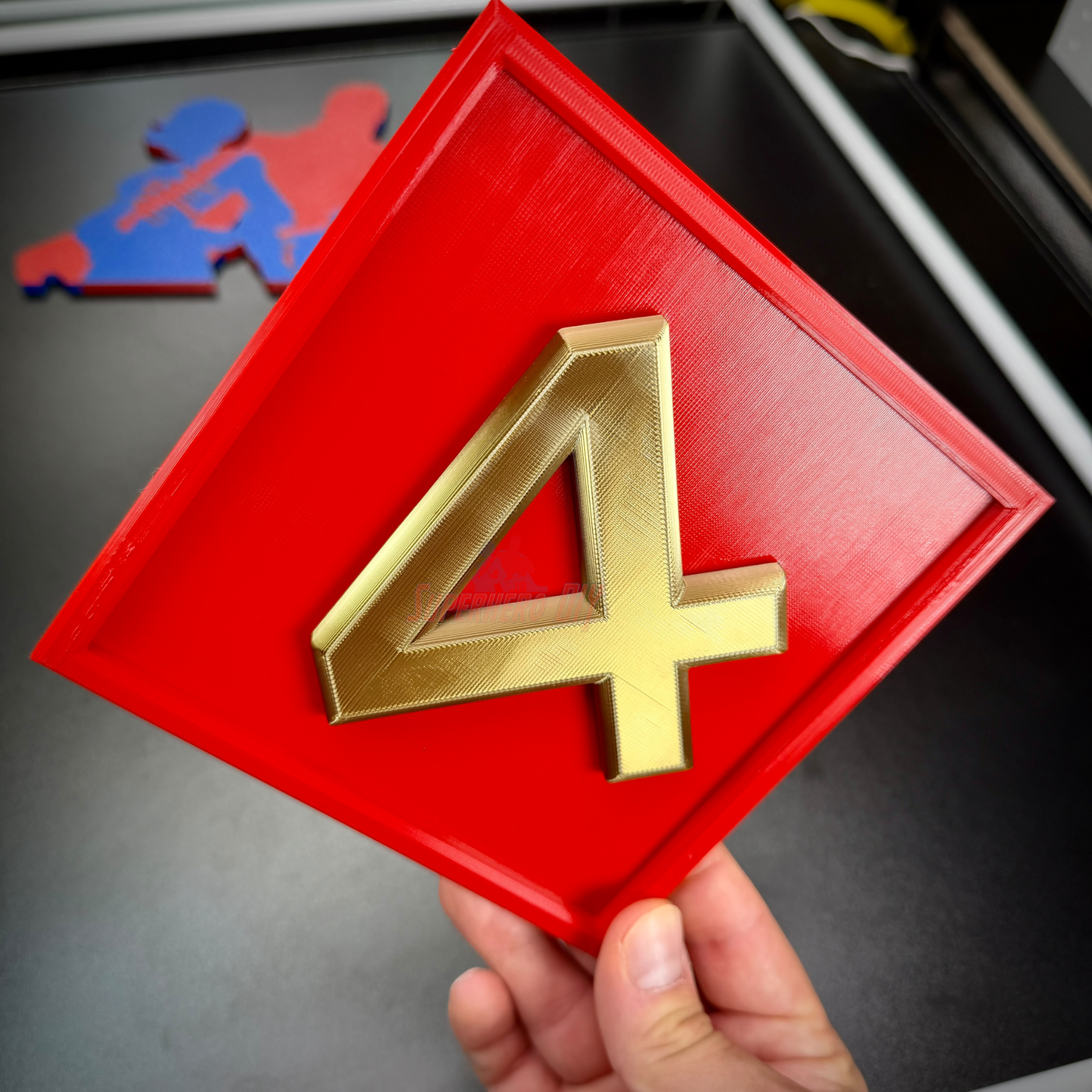 4th Marine Division display insignia with a red background and gold numeral four, perfect for wall mounting.