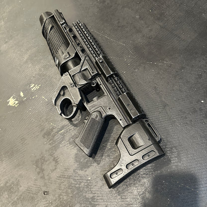 BvS Grenade Launcher Prop Batman v Superman displayed on a black surface, featuring a sleek 3D printed design.