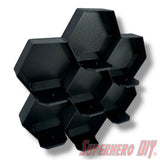 Wall-mounted honeycomb shelf for Disney Doorables, holds 7 figures with foot pegs for stable and organized display