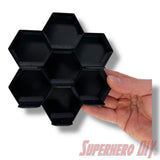 Wall-mounted honeycomb shelf for Disney Doorables, holds 7 figures with foot pegs for stable and organized display
