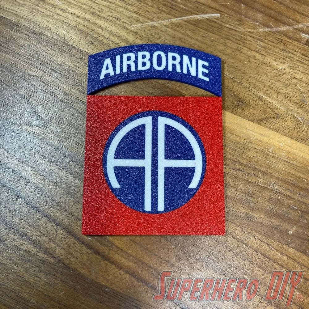 3D-printed 82nd Airborne Division display insignia on wooden background, showcasing "AA" symbol, perfect for collectors or veterans.